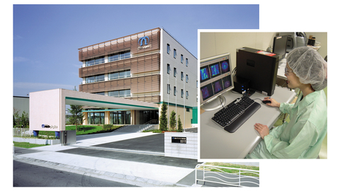 Nihon Medi-Physics headquarters and woman looking at molecular imaging images (Photo: Business Wire)